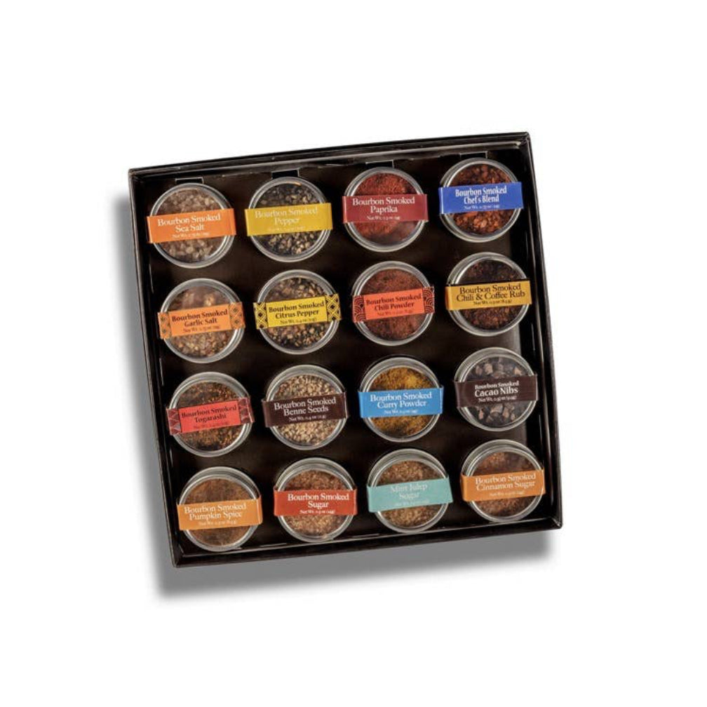 Set of 18 small round containers with lids, each labeled with a different spice or seasoning, arranged in a grid pattern on a white background.