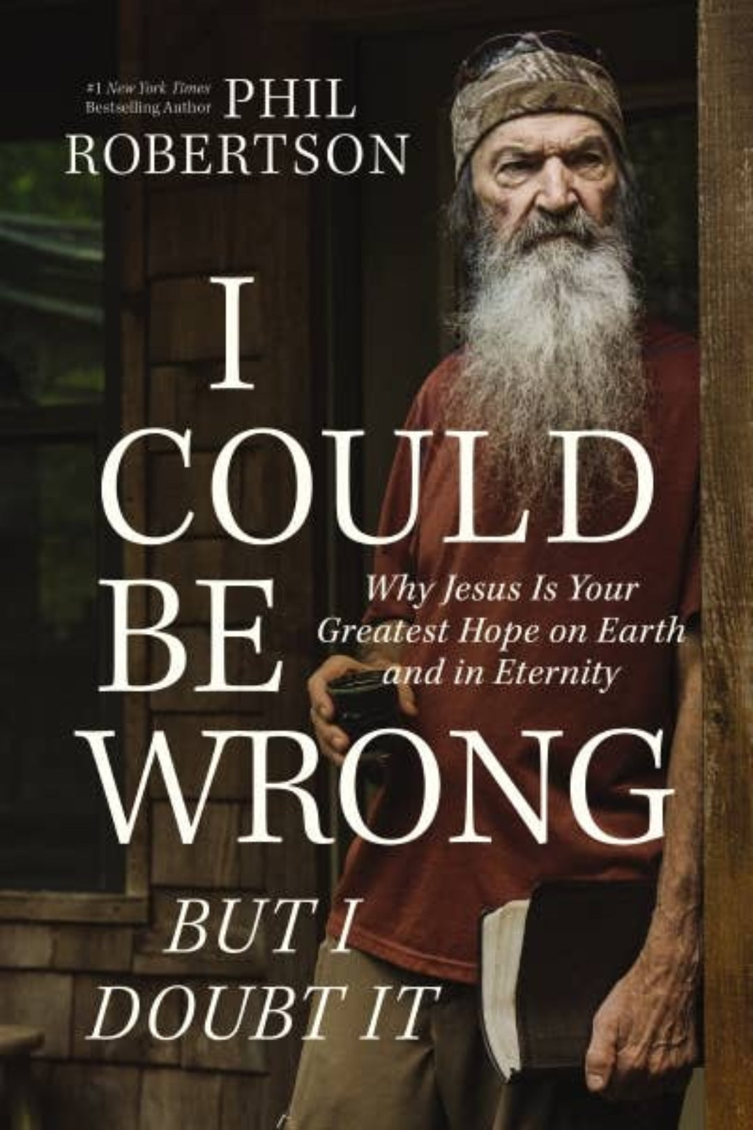Book cover of 'I Could Be Wrong But I Doubt It' by Phil Robertson with a man holding a cross.