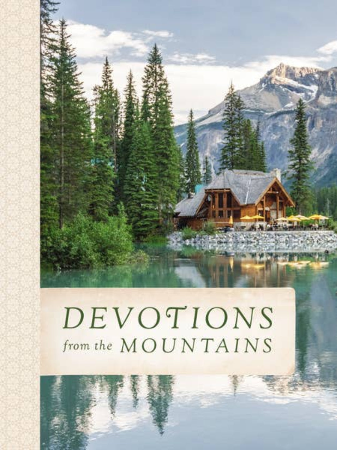 Book cover for 'Devotions from the Mountains' featuring a scenic photograph of a mountain cabin by a lake, surrounded by pine trees and a snow-capped peak in the background.
