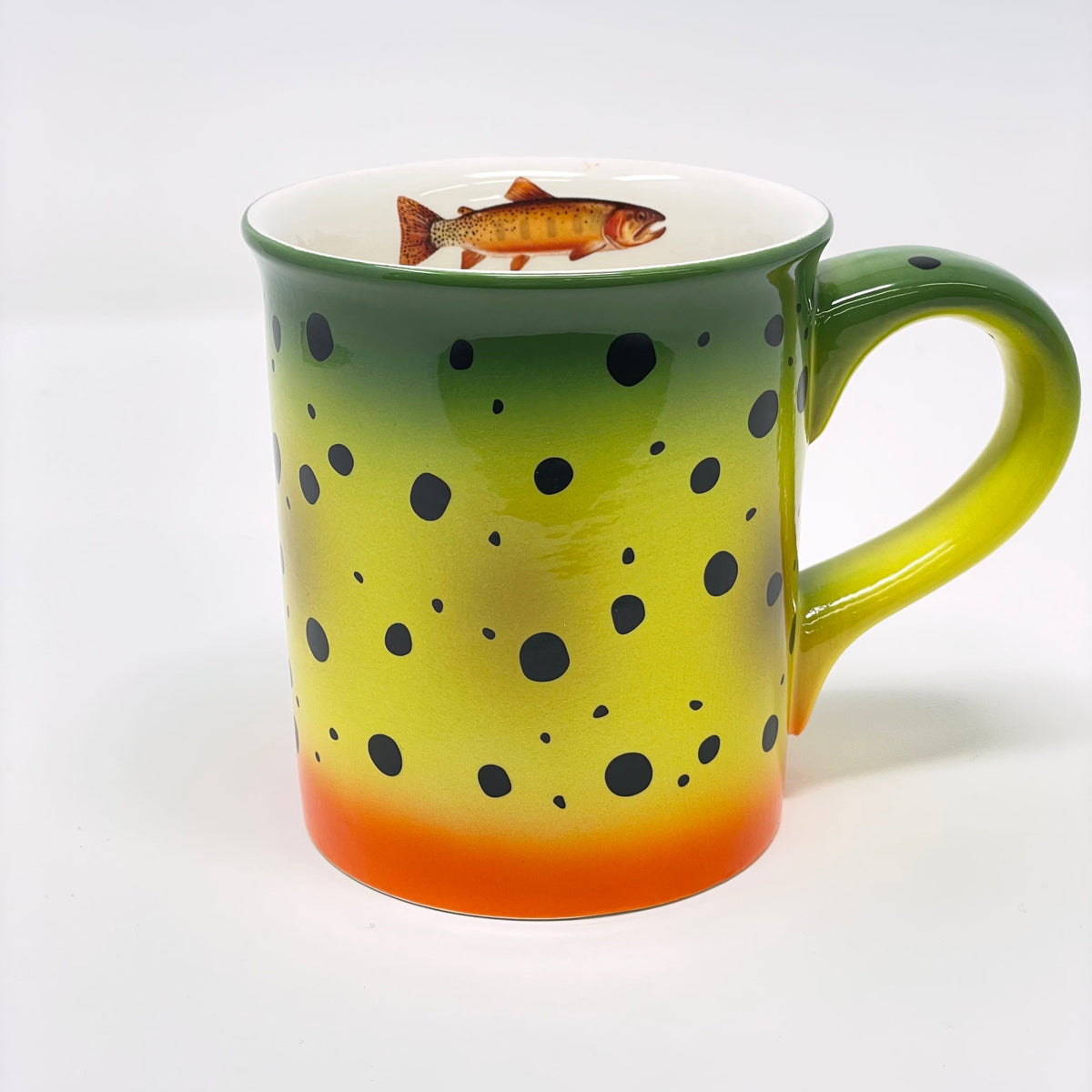 Mug with polka dot design and fish illustration on a white background