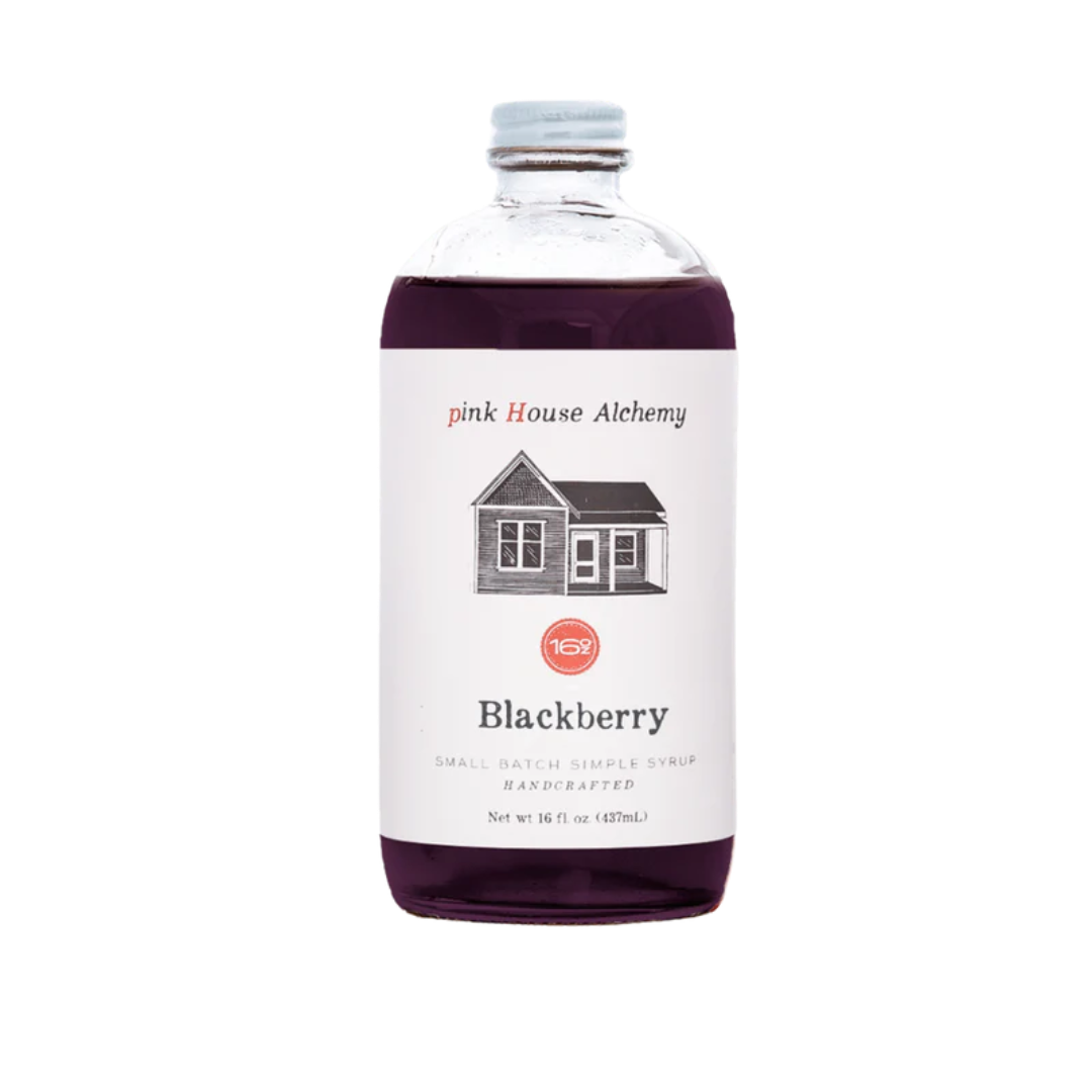Bottle of pink House Alchemy Blackberry liqueur on a white background
