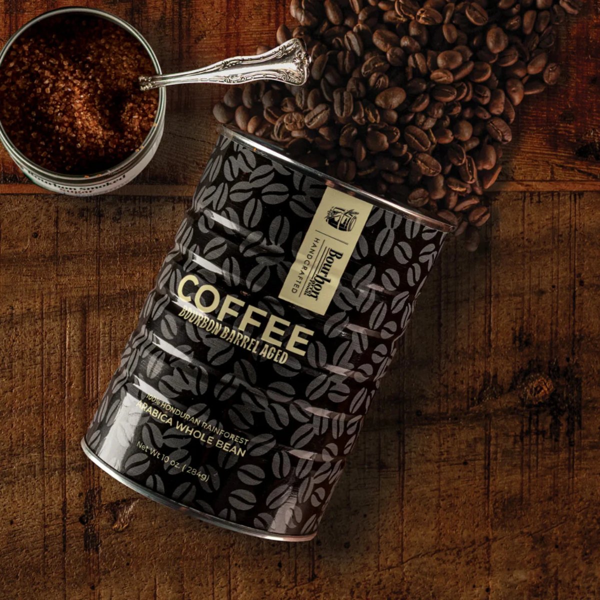 Coffee bag with coffee beans and a scoop on a wooden surface