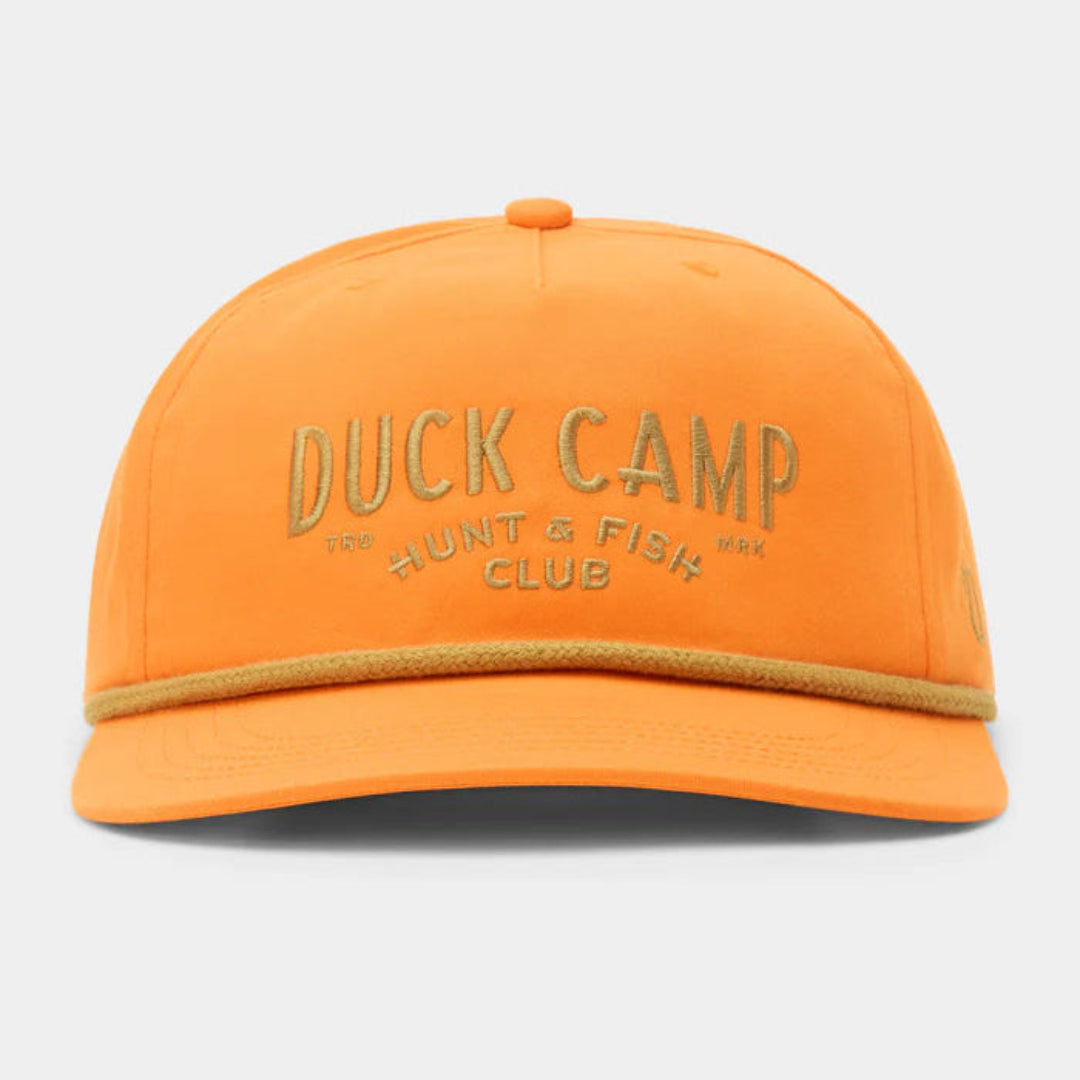 An orange snapback cap with 'DUCK CAMP THE HUNT & FISH CLUB' embroidered in a metallic gold tone on the front, featuring a matching orange visor and a thin gold embroidered stripe along the edge.