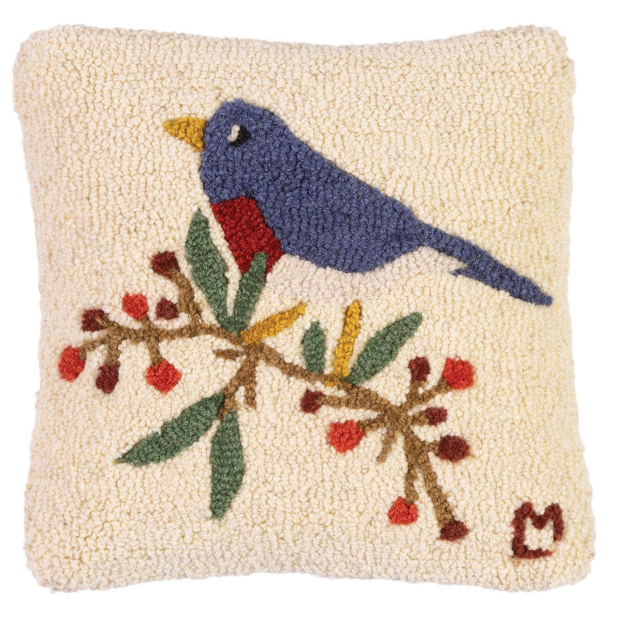 Decorative pillow with a bird and branch design on a beige background
