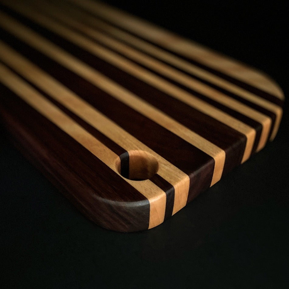 This awesome serving board or bread board is Handcrafted with Walnut & Curley Cherry. 