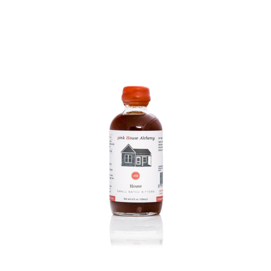 Bottle of 'Pink House Alchemy' bitters on a white background