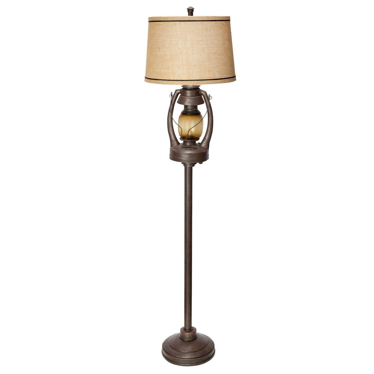 A rustic-style floor lamp with a tall dark bronze metal stand, a textured beige fabric drum shade, and a decorative amber glass bulb, shown against a plain white background.