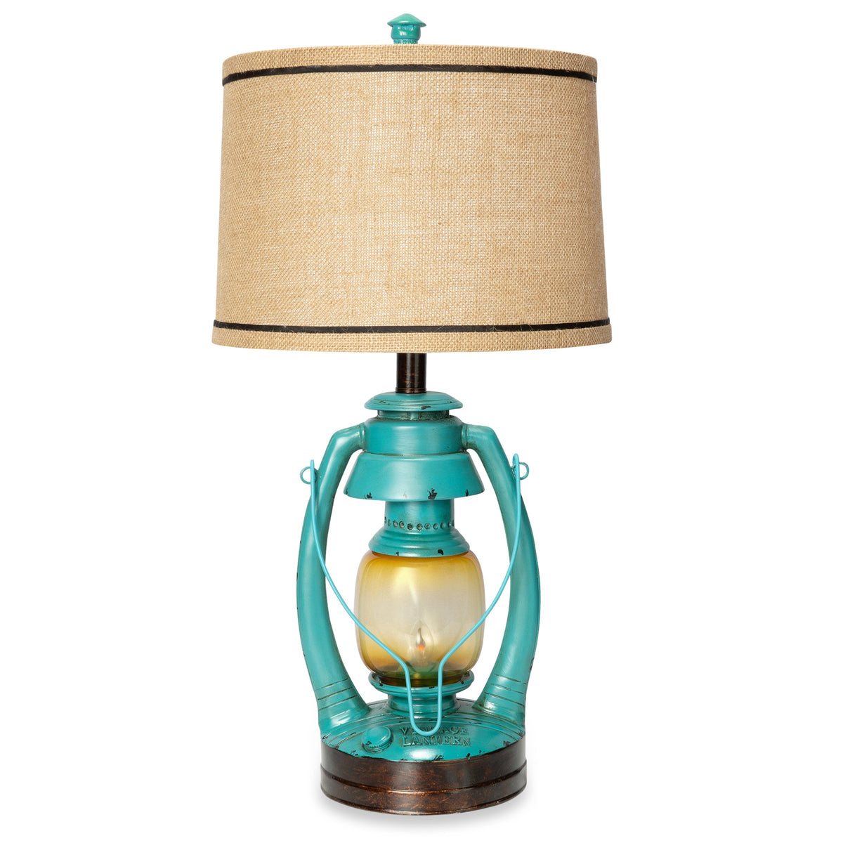 A table lamp with a beige linen drum shade, black trim, and a turquoise metal lantern-style base with a warm yellow glass globe and dark bronze circular foot, shown on a white background.