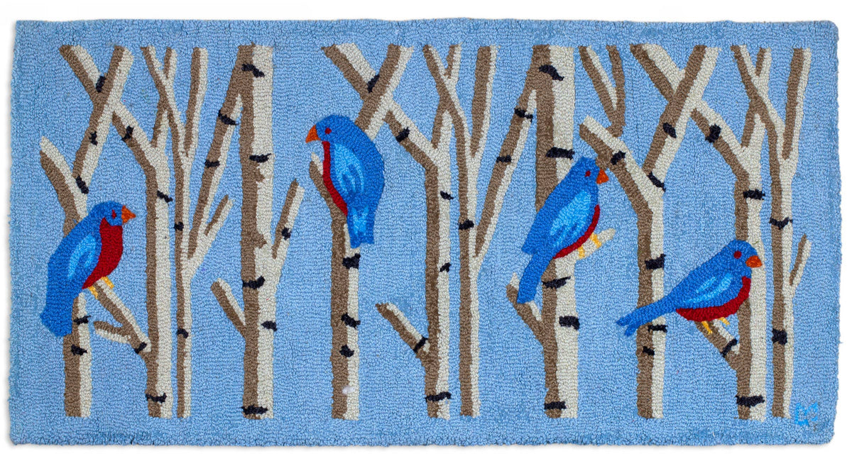 Rug with blue birds on branches design on a blue background