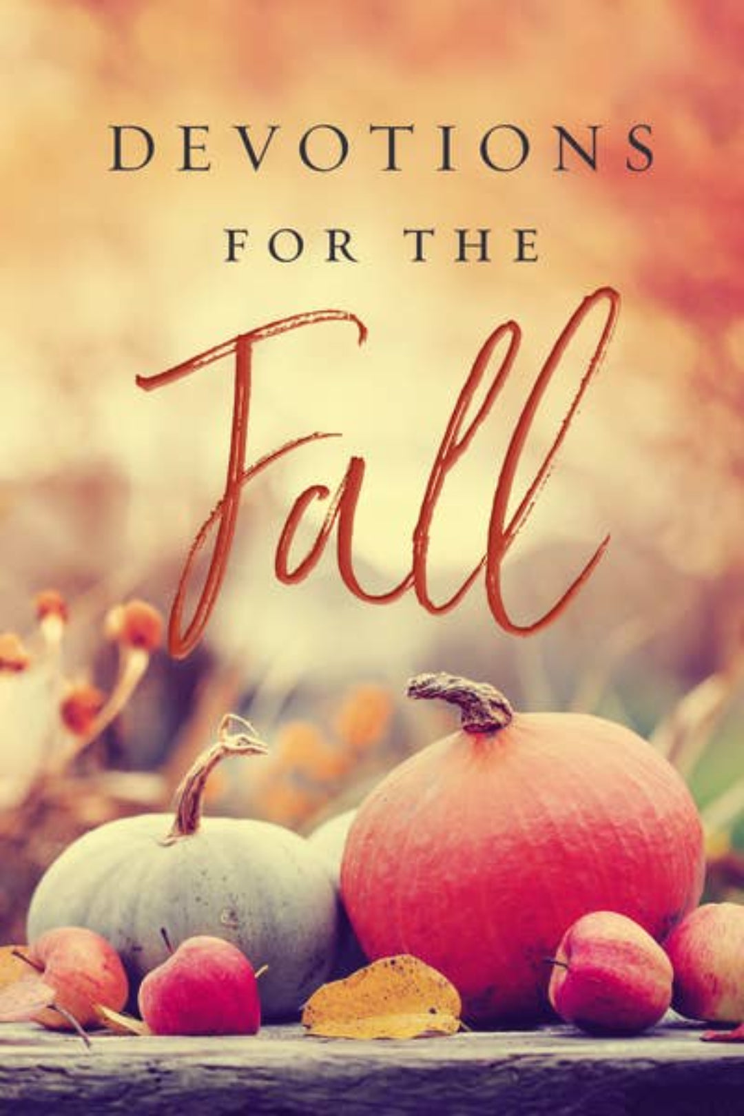 A book cover titled 'DEVOTIONS FOR THE Fall' featuring a warm autumn scene with pumpkins, apples, and leaves on a rustic surface.